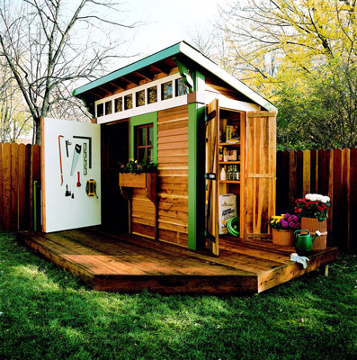 wooden shed with a small deck