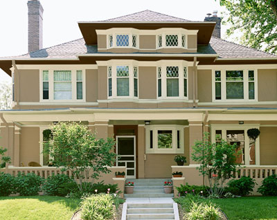 Victorian style house with tan exterior paint color